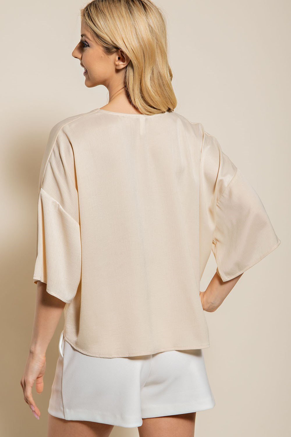 BACK VIEW OF CREAM TIE-FRONT TOP, 100% Polyester, ideal for trendy coastal style from Raggdoll Boutique.