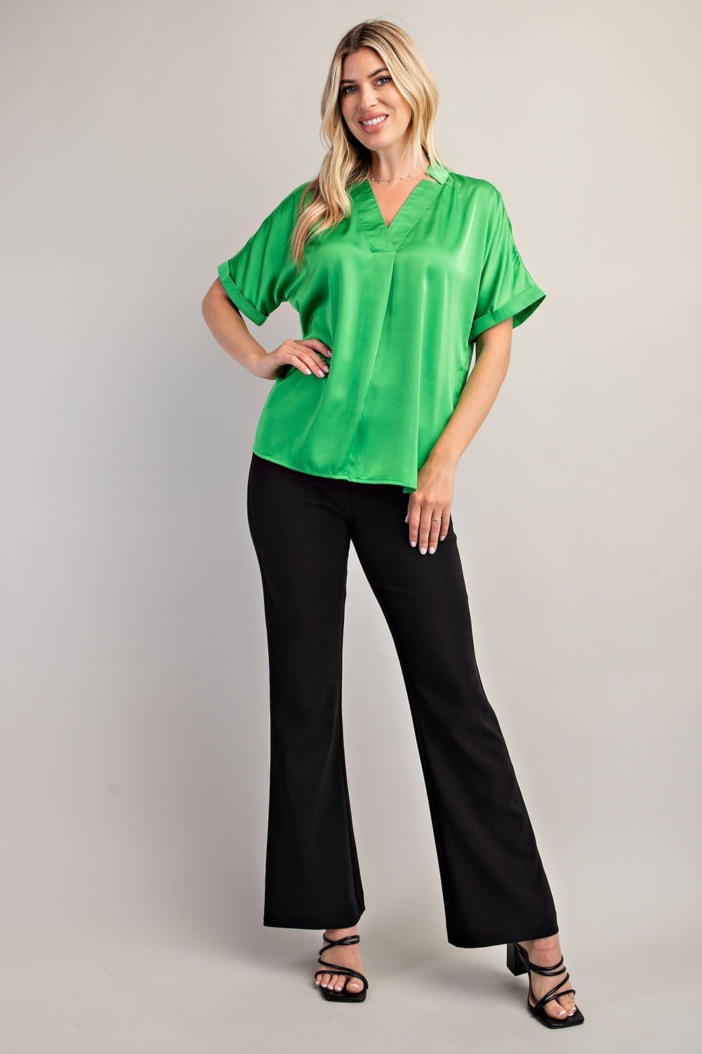 Abby Top in Kelly Green styled with black pants, perfect for trendy coastal style from Raggdoll Boutique.