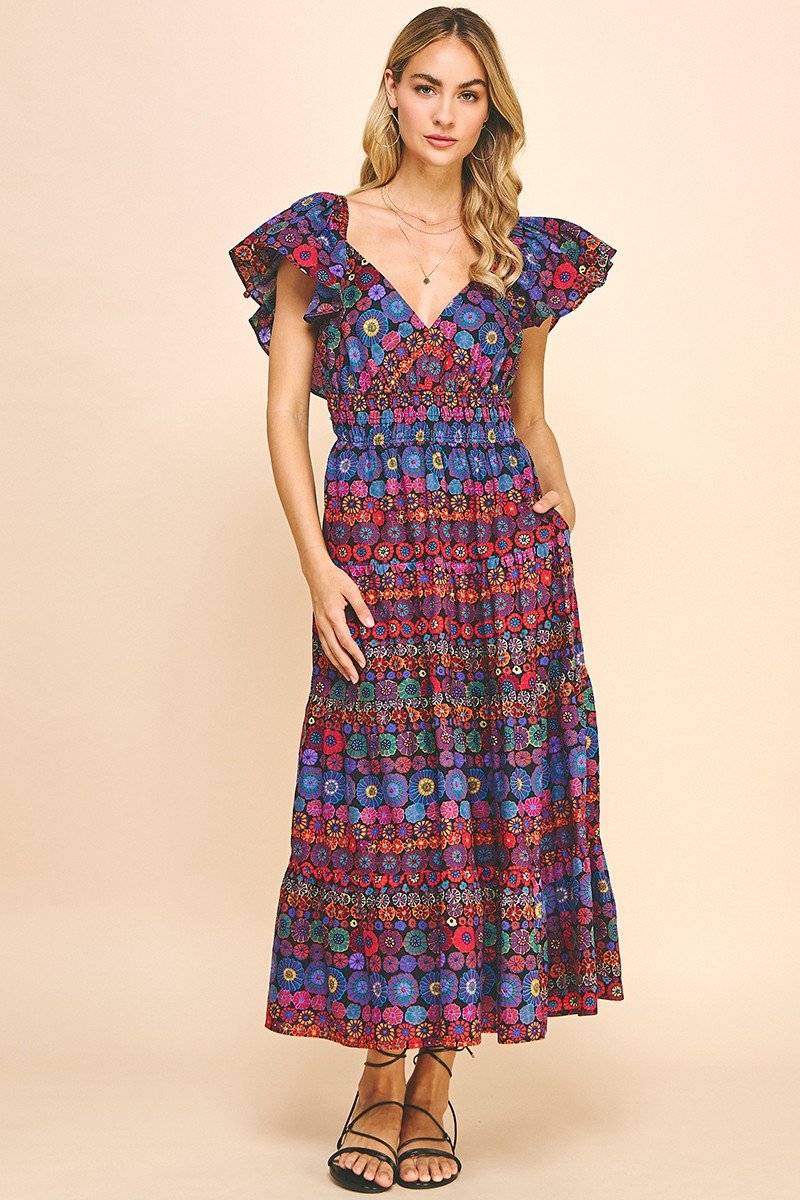 Happy Flowers Dress w/Open-Back Detail model showcasing trendy coastal style at Raggdoll Boutique.