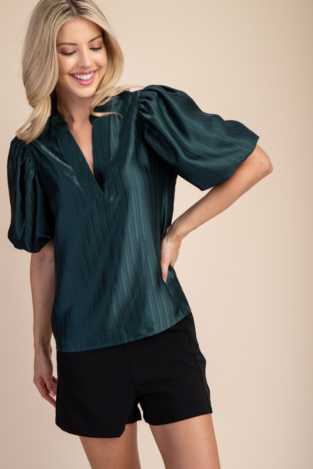 HUNTER GREEN PUFF SLEEVE TOP displayed on a model from Raggdoll Boutique in Texas, perfect for summer outfits and coastal fashion.