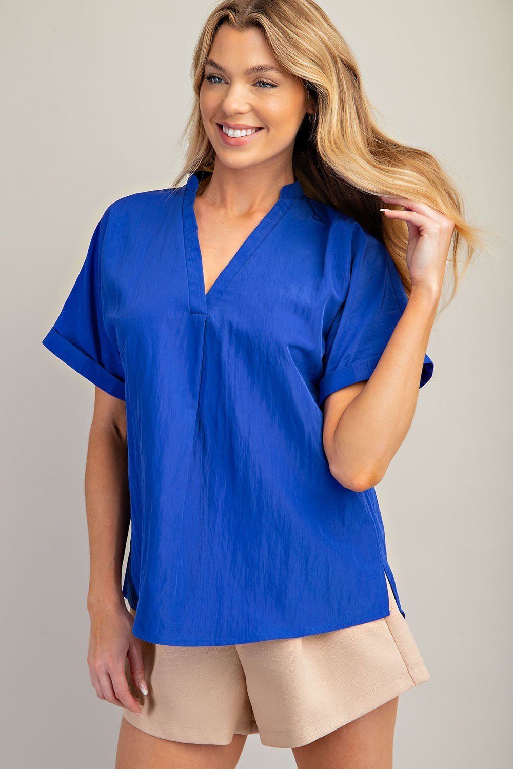 Stylish royal blue V-neck top for women, perfect for coastal boutique clothing and tropical vacations.
