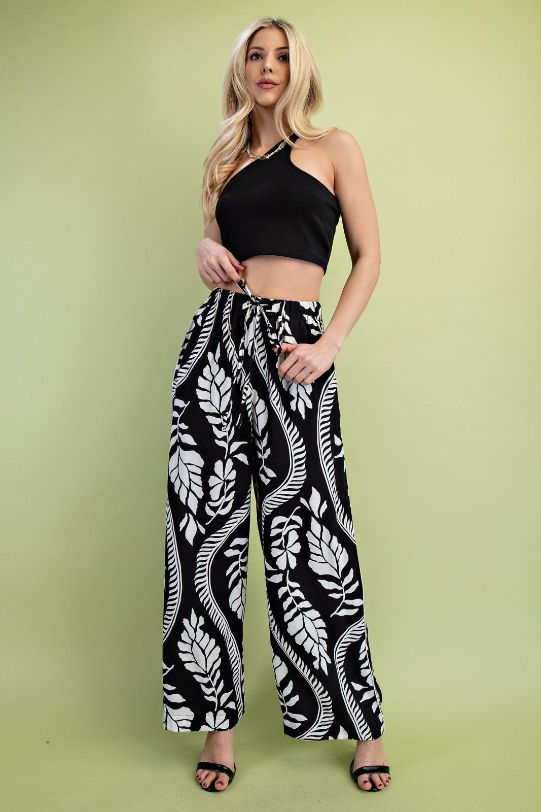 Black Pattern Leaf Drawstring Pants from a coastal boutique, featuring stylish design perfect for tropical vacations and everyday fashion.