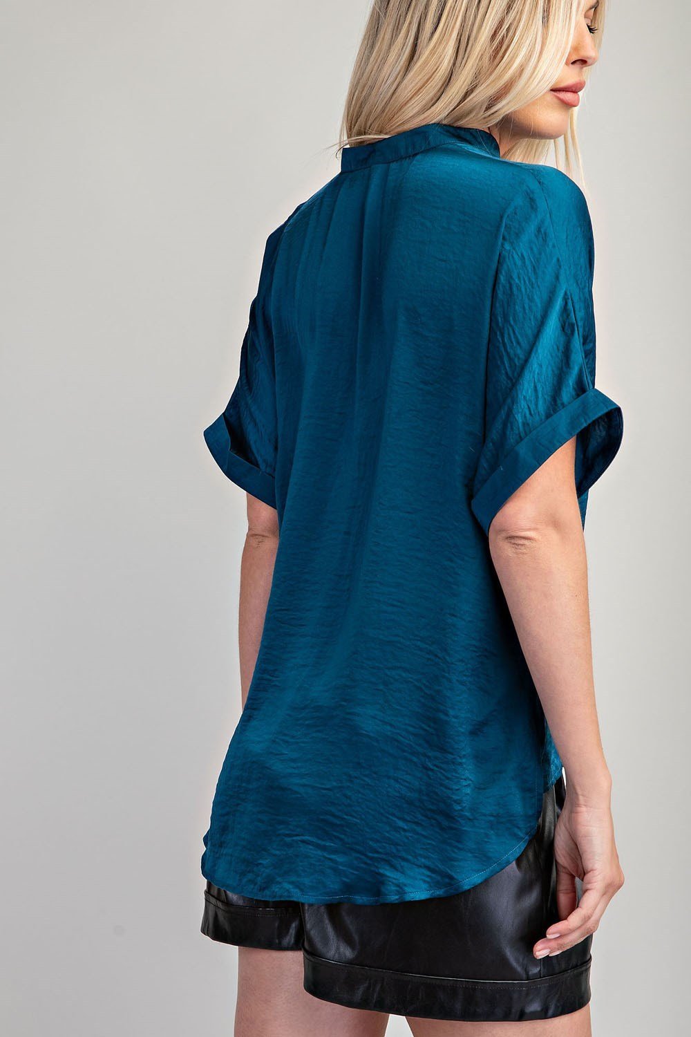 Teal top made of 100% polyester, perfect for coastal boutique clothing and stylish tops for women.
