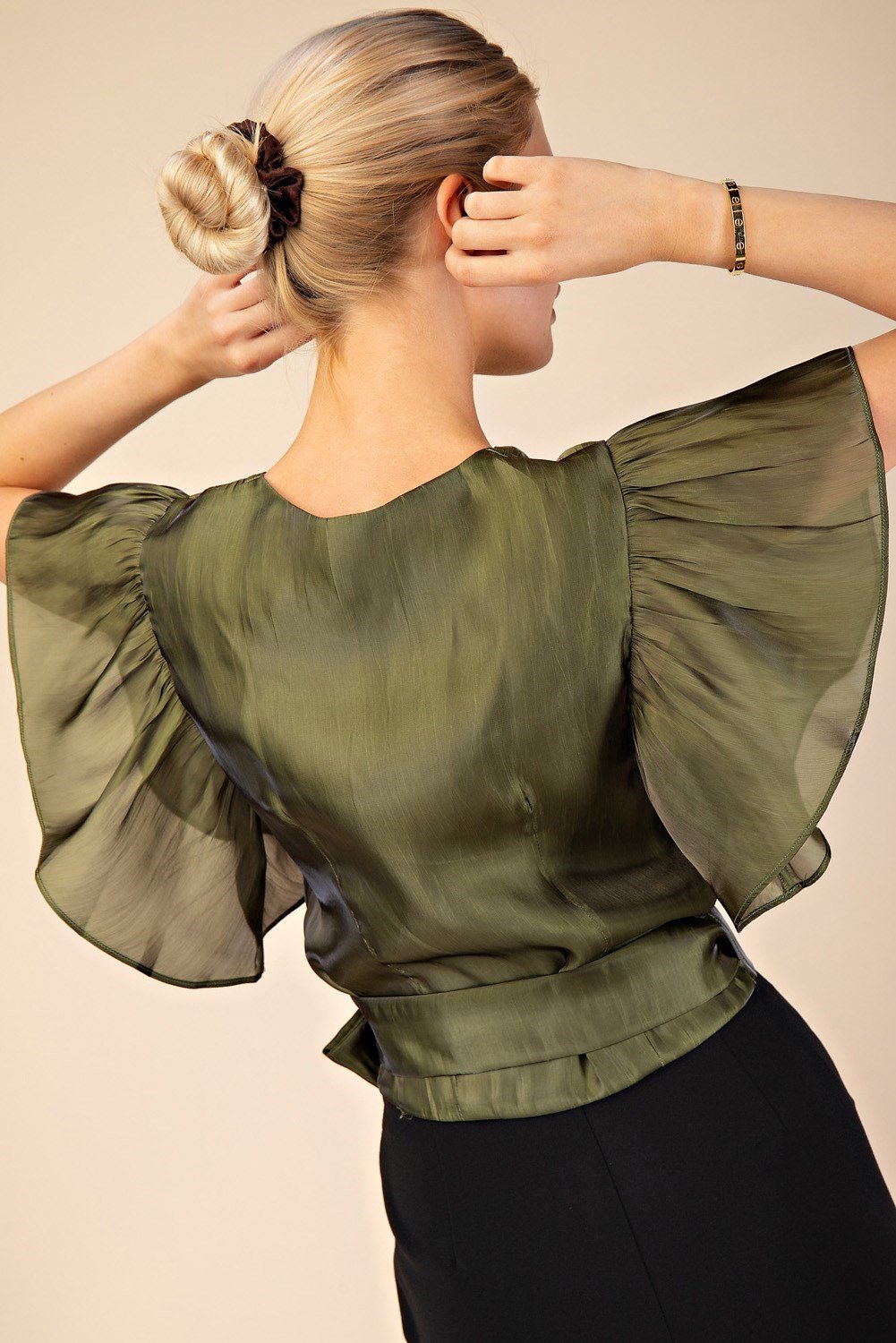 Stylish SHAY olive top from a coastal boutique, perfect for tropical vacations and curated women's fashion. Lightweight and fashionable.