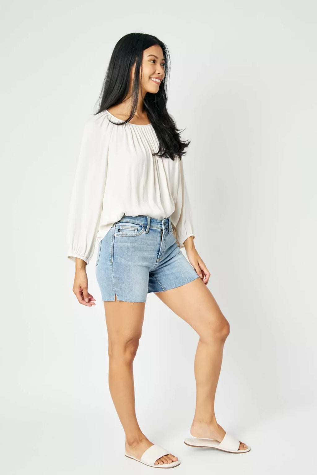 JUDY BLUE CUT OFF RAW HEM SHORTS-MID RISE styled with a trendy top, perfect for summer outfits Texas from Raggdoll Boutique.