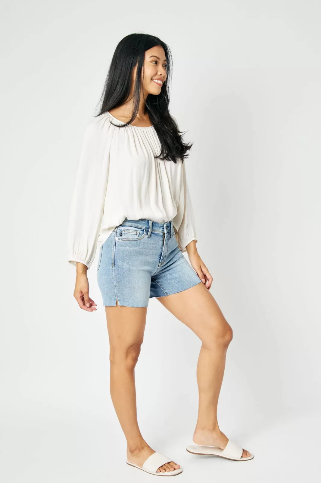 JUDY BLUE CUT OFF RAW HEM SHORTS-MID RISE styled with a trendy top, perfect for summer outfits Texas from Raggdoll Boutique.