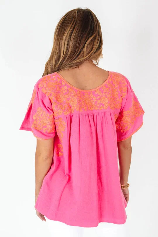 THE COURTNEY TOP in bright pink with floral embroidery, perfect for summer outfits Texas from Raggdoll Boutique.