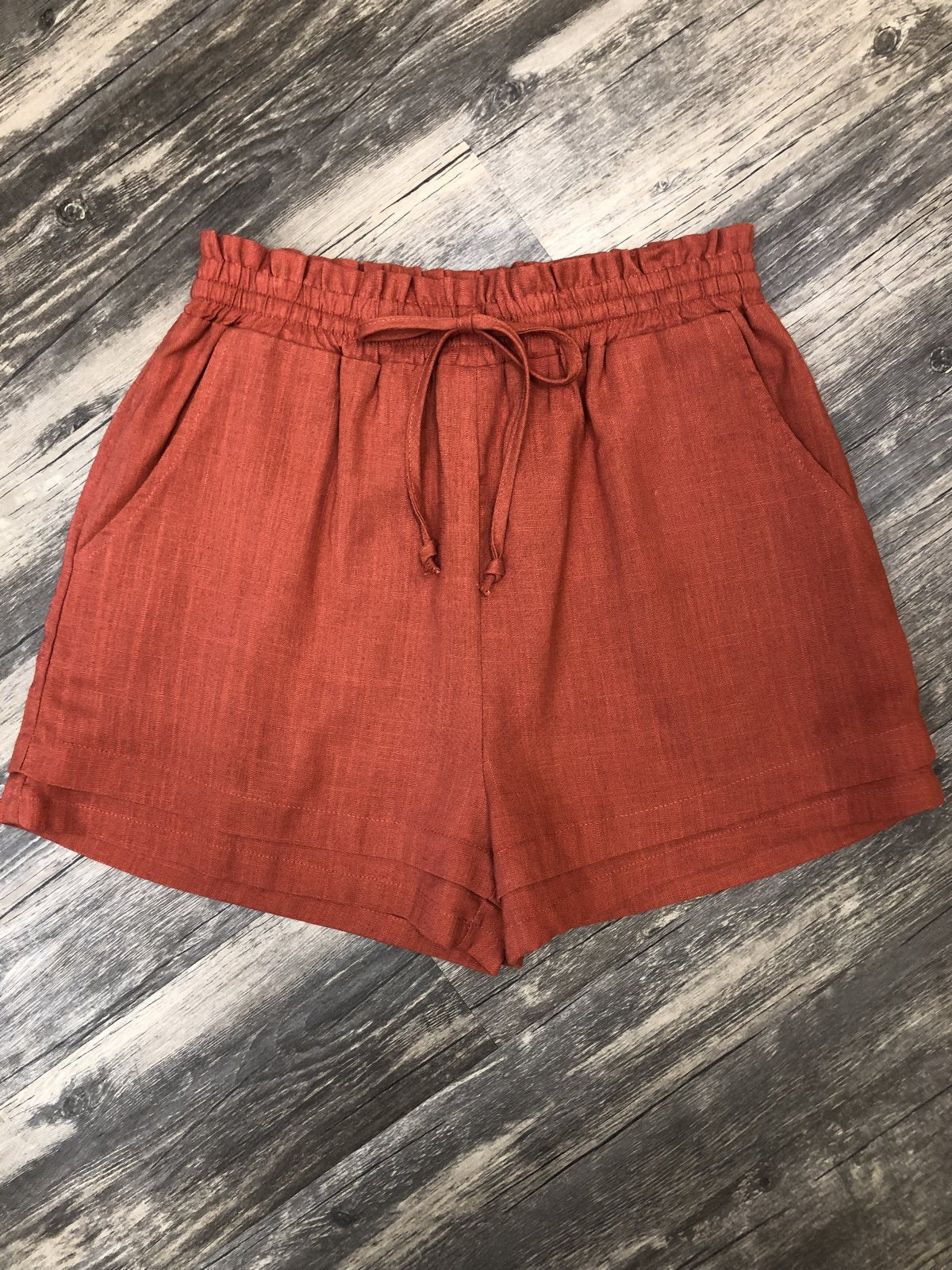 RUST LINEN-LIKE SHORTS from Raggdoll Boutique, perfect for a trendy coastal style and summer outfits in Texas.