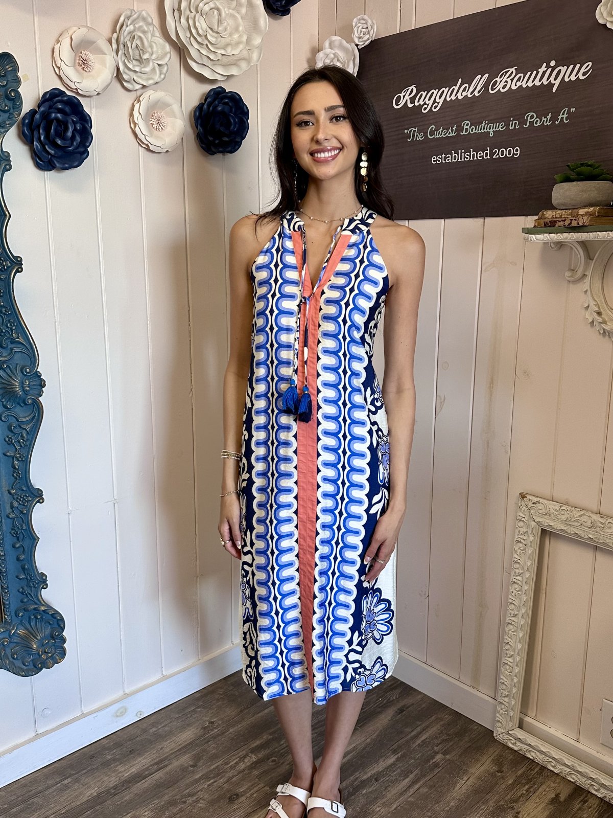 A stylish sleeveless Ava Dress from THML, perfect for coastal boutique clothing in Port Aransas, great for tropical vacations.