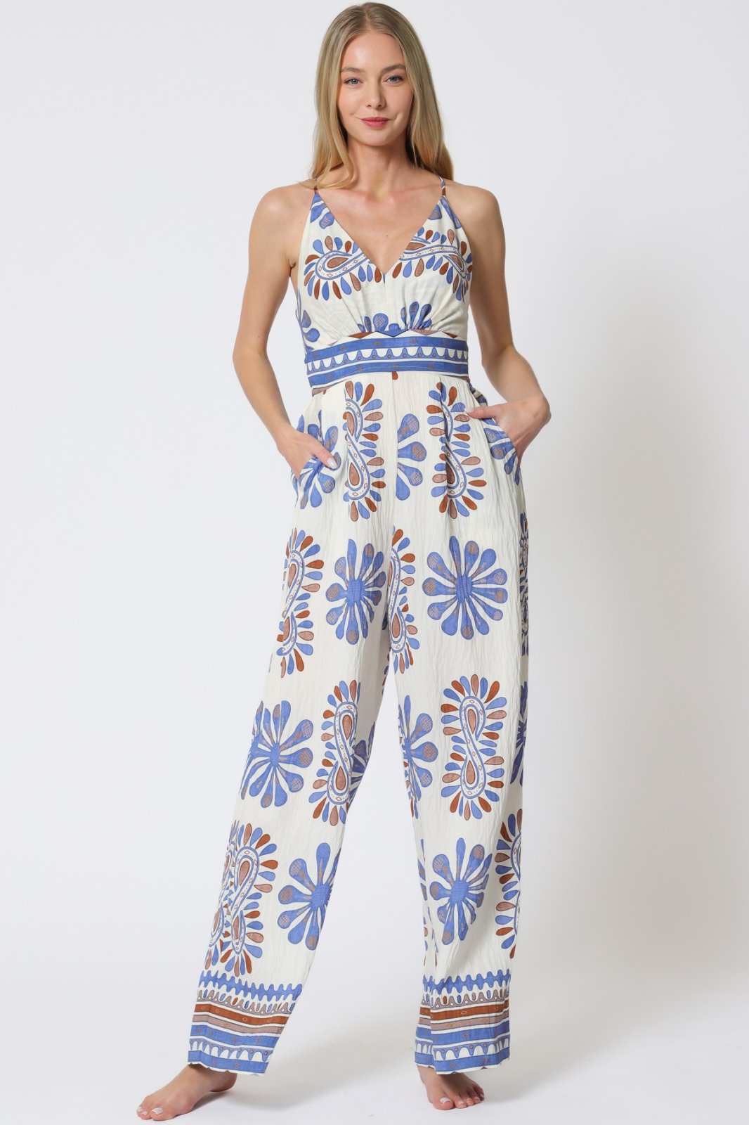 Trendy blue print sleeveless jumpsuit from coastal boutique clothing, perfect for sunny days and tropical vacations.