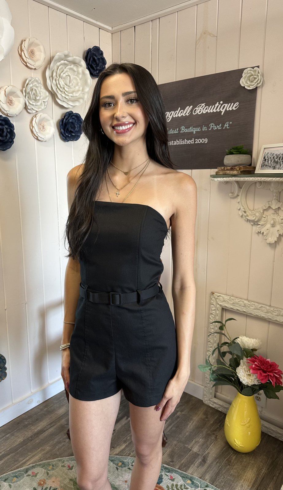 Black strapless bustier romper from a coastal boutique, perfect for tropical vacations and curvy plus size fashion.
