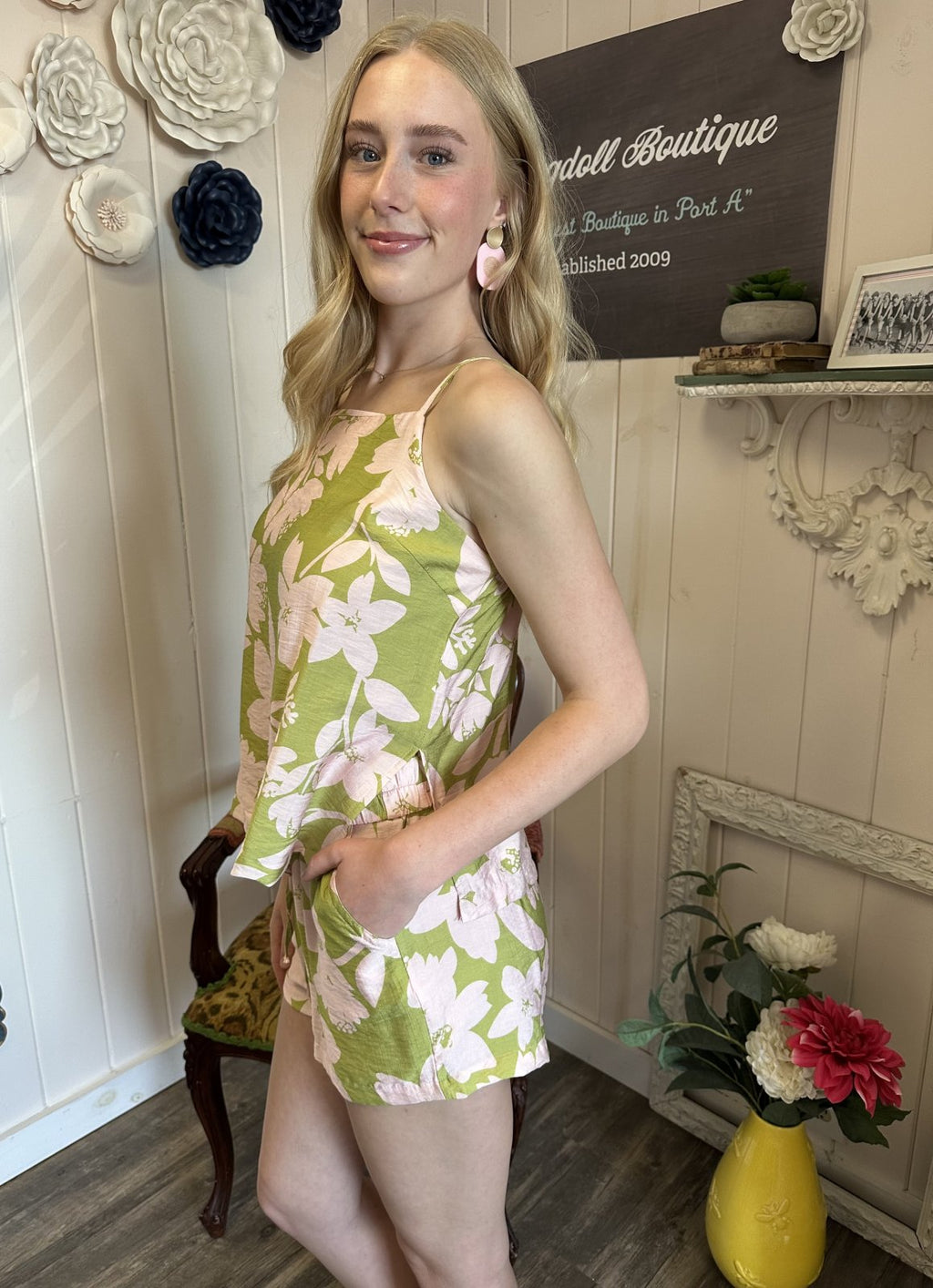 Green floral short set with pink flowers, perfect for coastal boutique clothing and tropical vacation dresses.