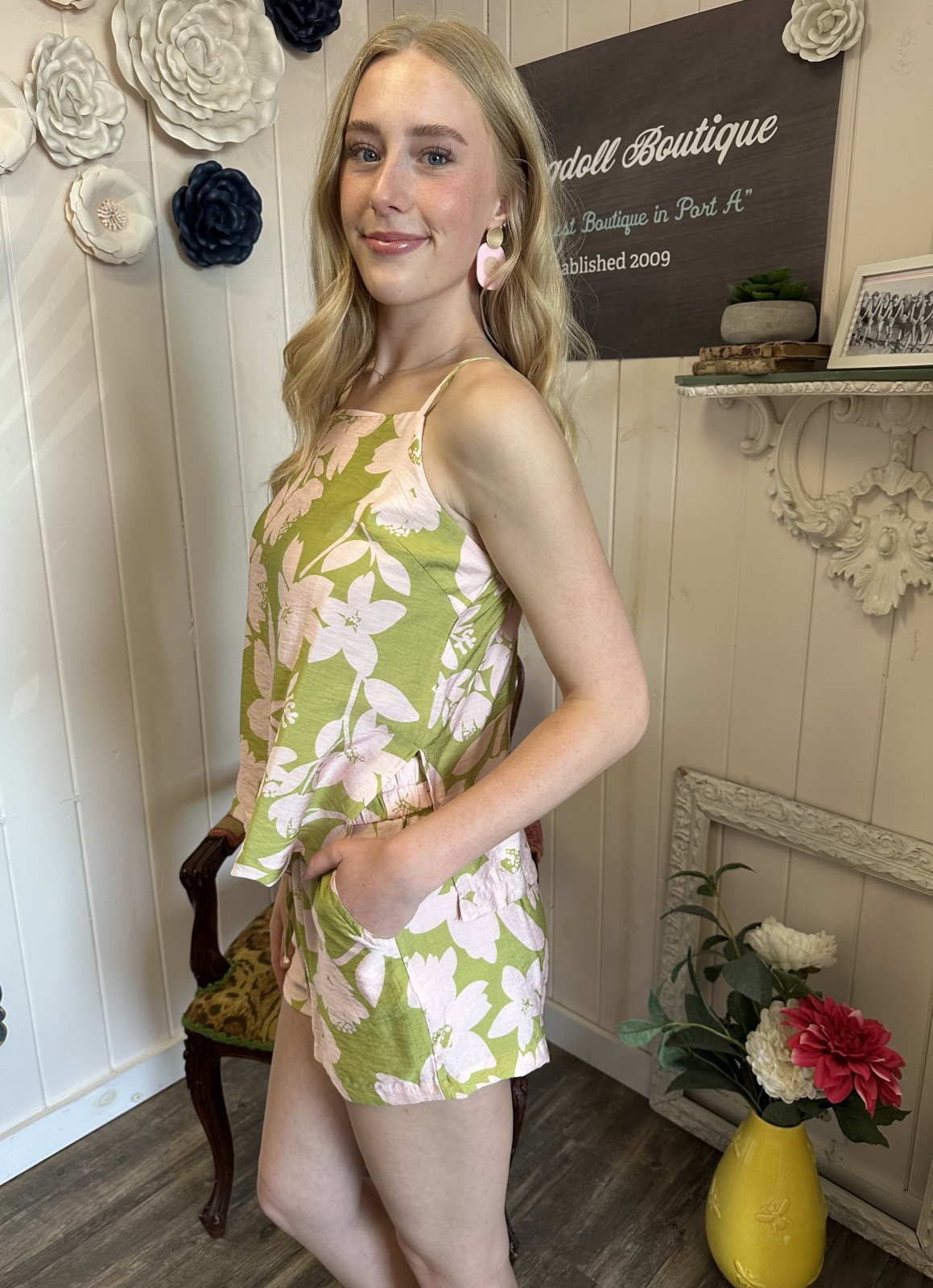 Green floral short set with pink flowers, perfect for coastal boutique clothing and tropical vacation dresses.