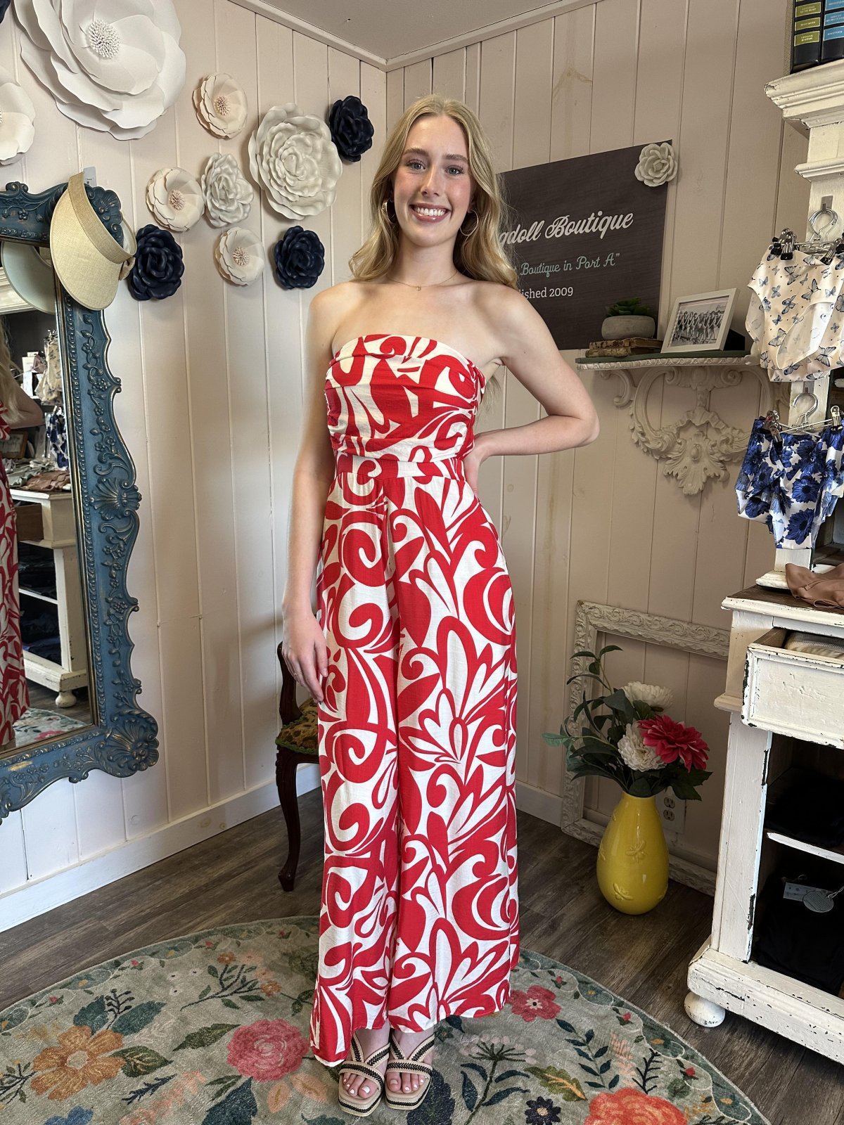 Stylish red and ivory halter jumpsuit from coastal boutique clothing, perfect for summer events and vacations.