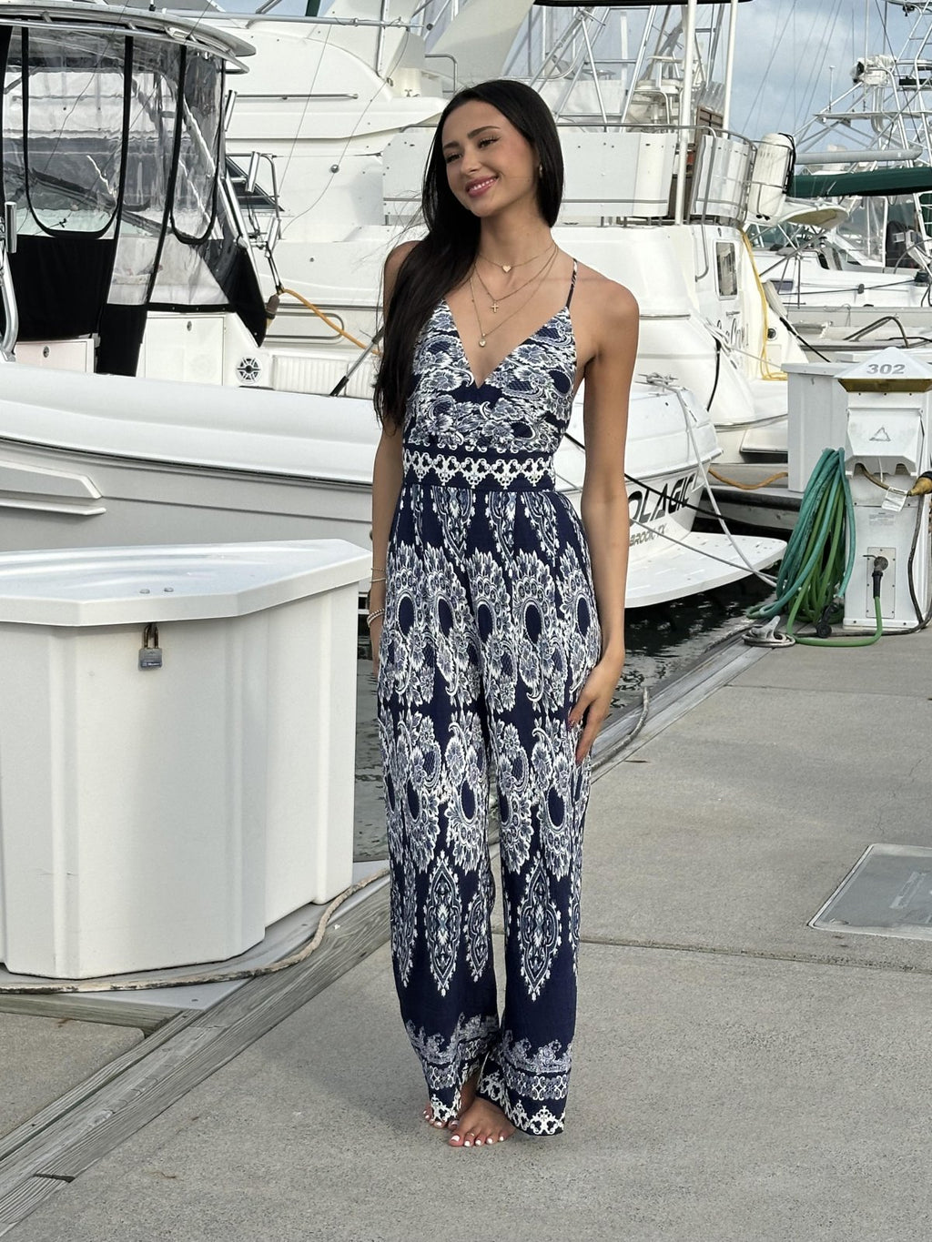 Navy and white sleeveless jumpsuit from coastal boutique clothing, perfect for beach outings and tropical vacations.