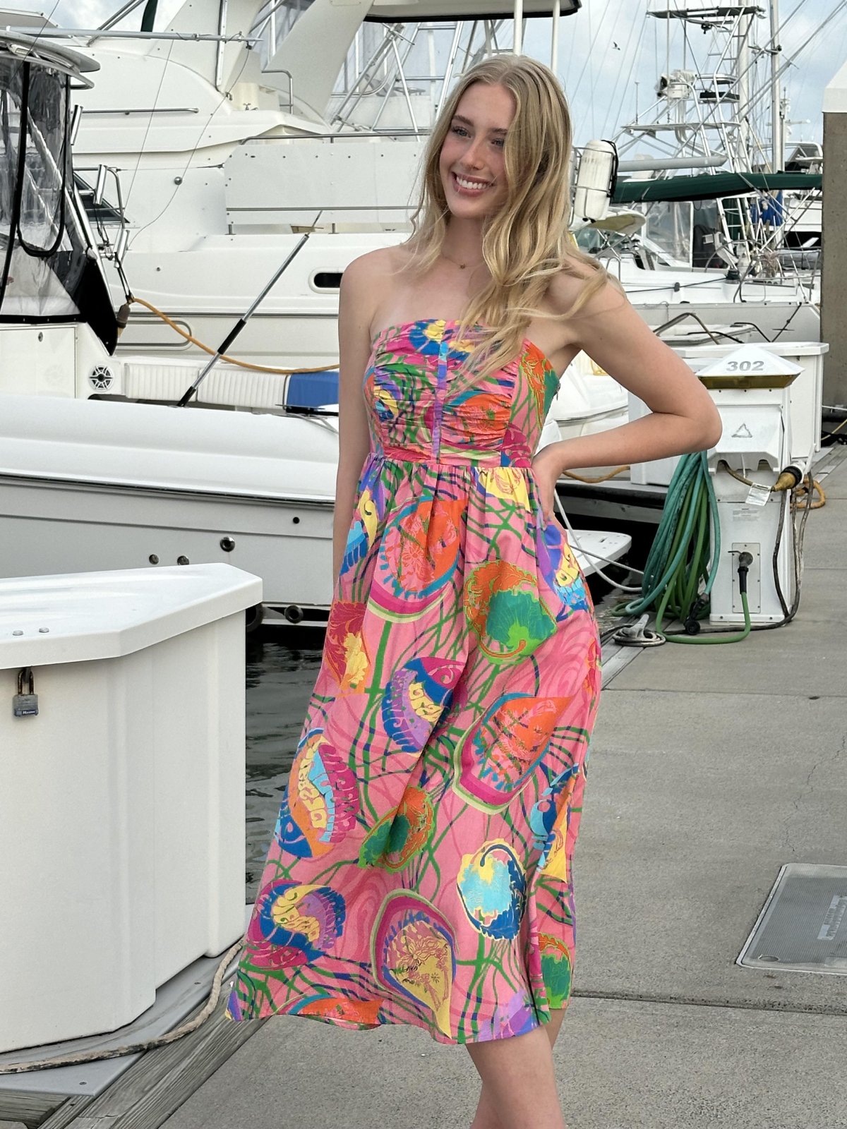 Stylish multi-colored strapless dress perfect for coastal boutique clothing and tropical vacation dresses at Port Aransas.