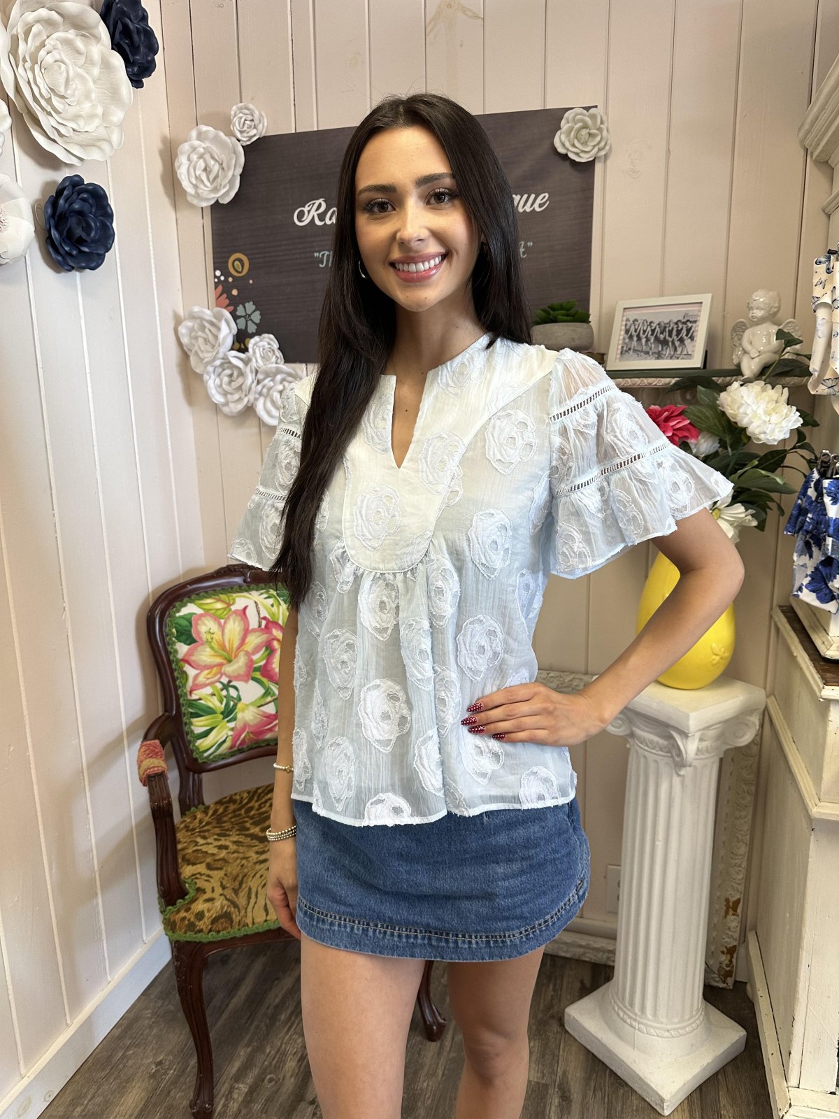 Light blue flowy top with floral embroidery, perfect for coastal boutique clothing and stylish summer outings.