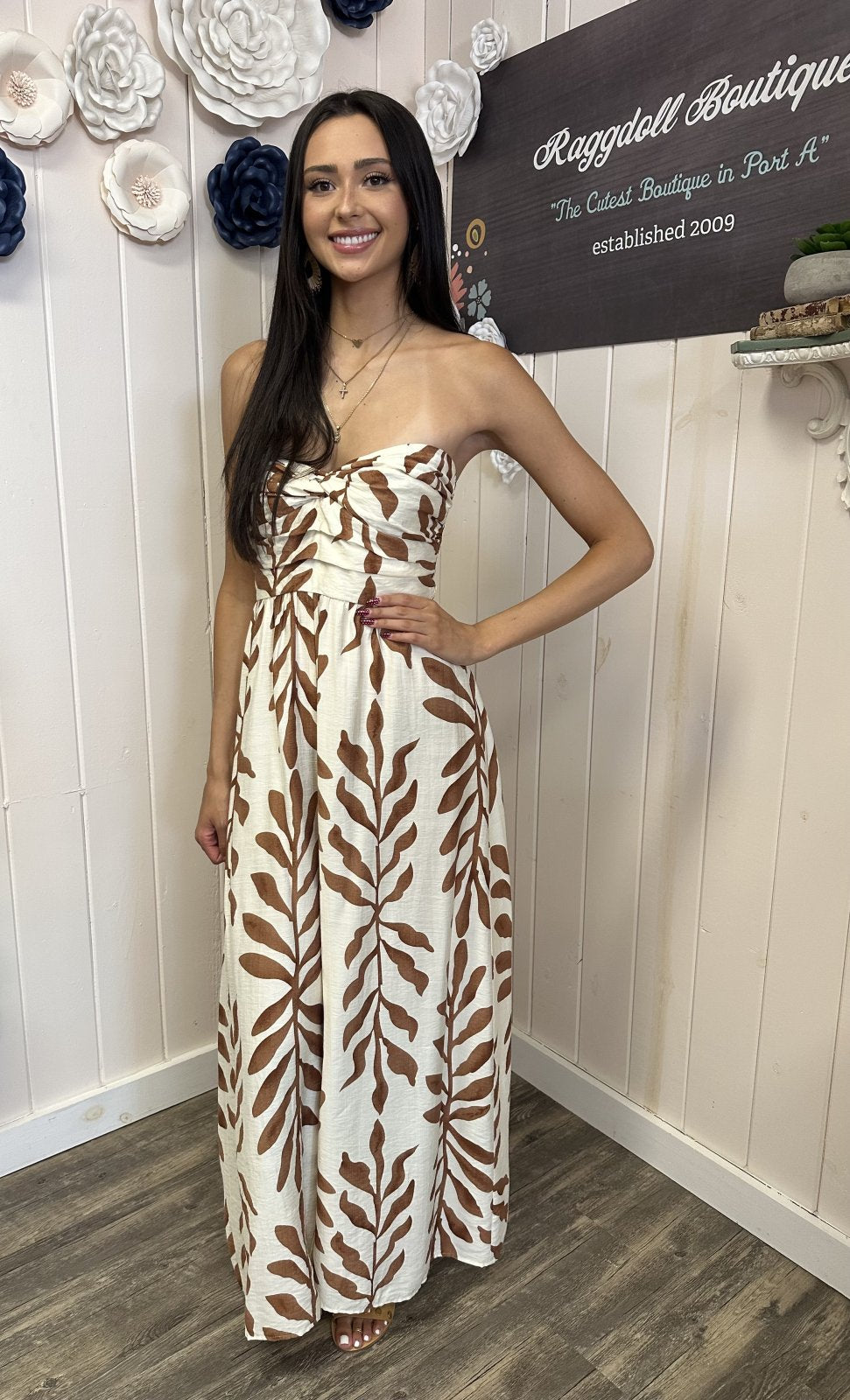 Stylish strapless ivory and light brown jumpsuit from Port Aransas boutique, perfect for coastal outings and travel-ready looks.