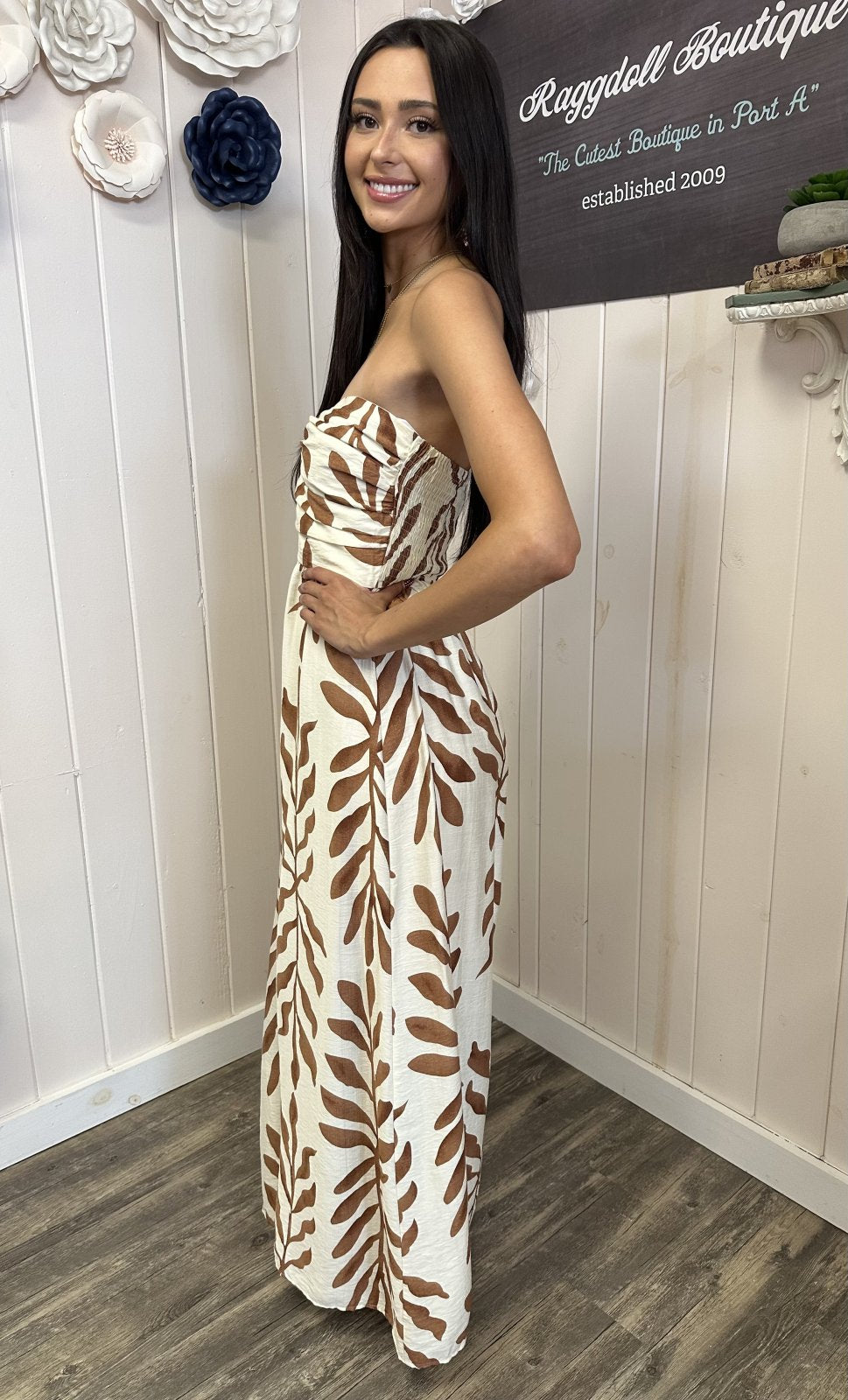 Stylish ivory and light brown jumpsuit from coastal boutique clothing, perfect for summer outings and tropical vacations.
