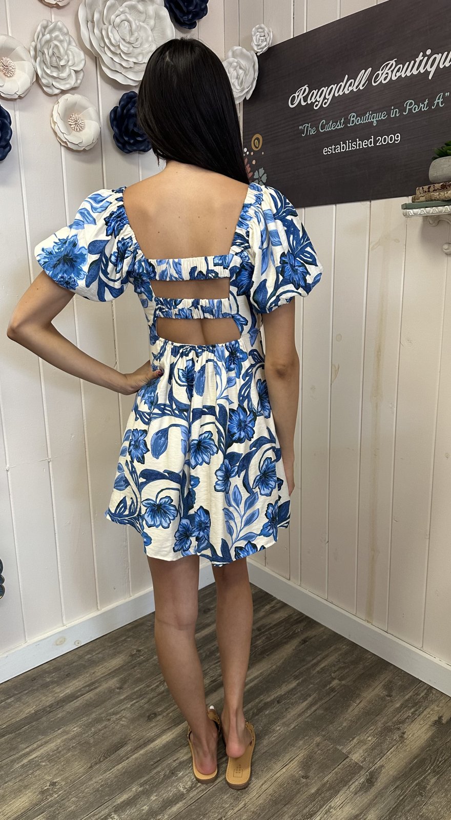 Back view of Clara Dress showcasing floral design, perfect for Port Aransas beach, ideal for tropical vacations and curvy fashion.