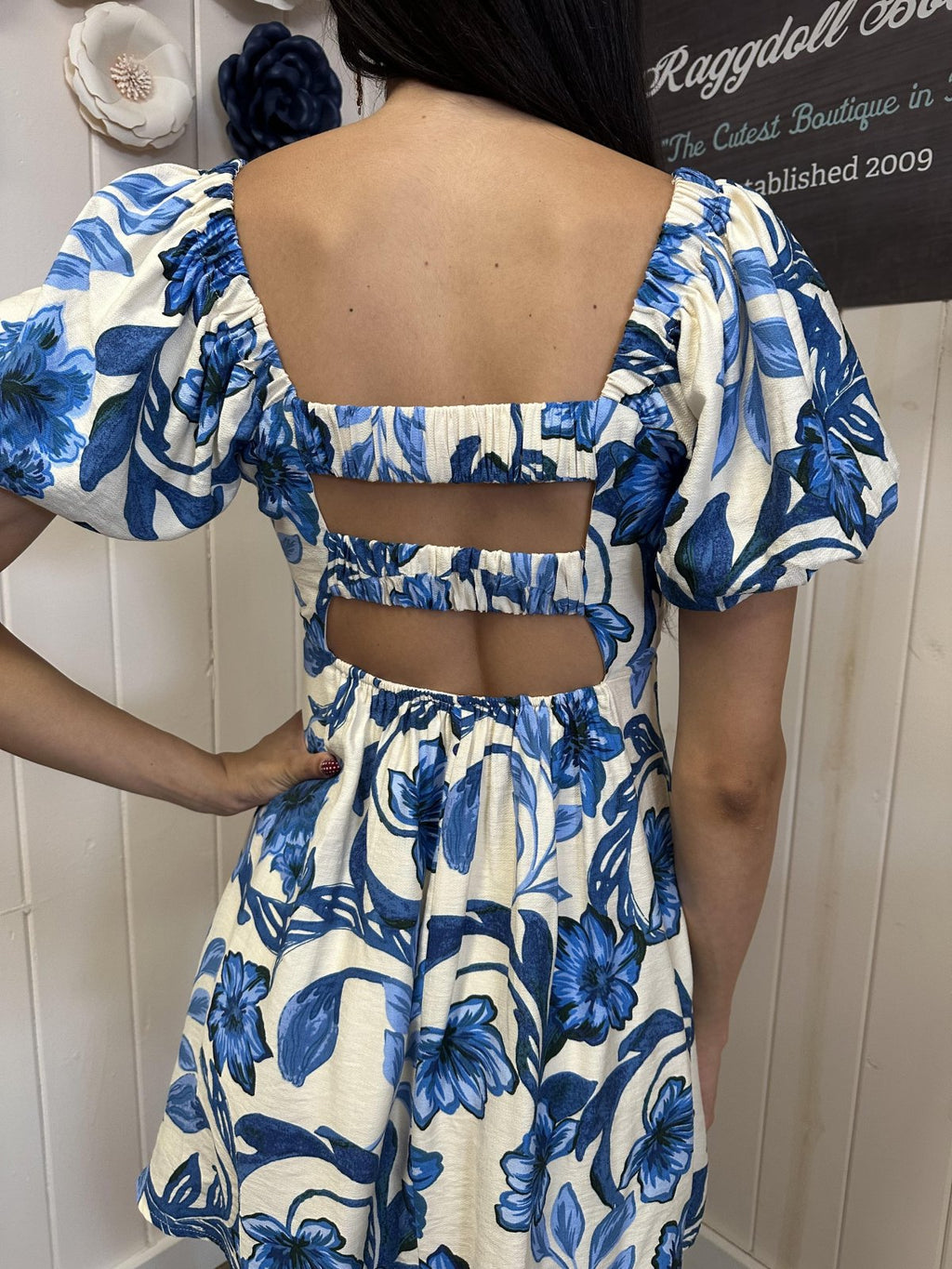 Back view of Clara Dress featuring a floral print, perfect for beach outings and curated women's fashion at Port Aransas boutique.