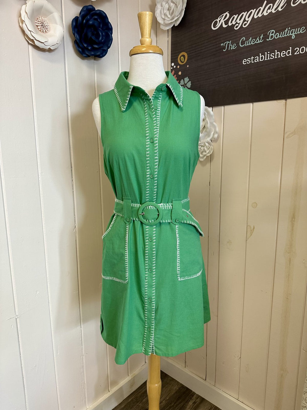 Green sleeveless Daisy dress with button-down front and waist belt. Perfect for coastal boutique clothing and tropical vacations.