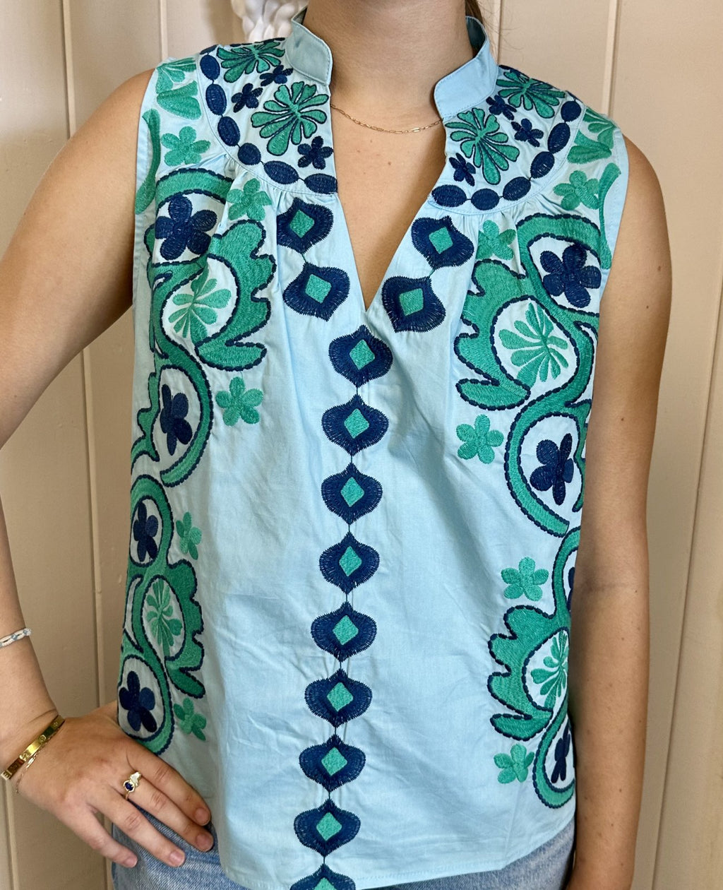Molly Top from THML, a vibrant embroidered short sleeve top, perfect for a coastal boutique clothing style.