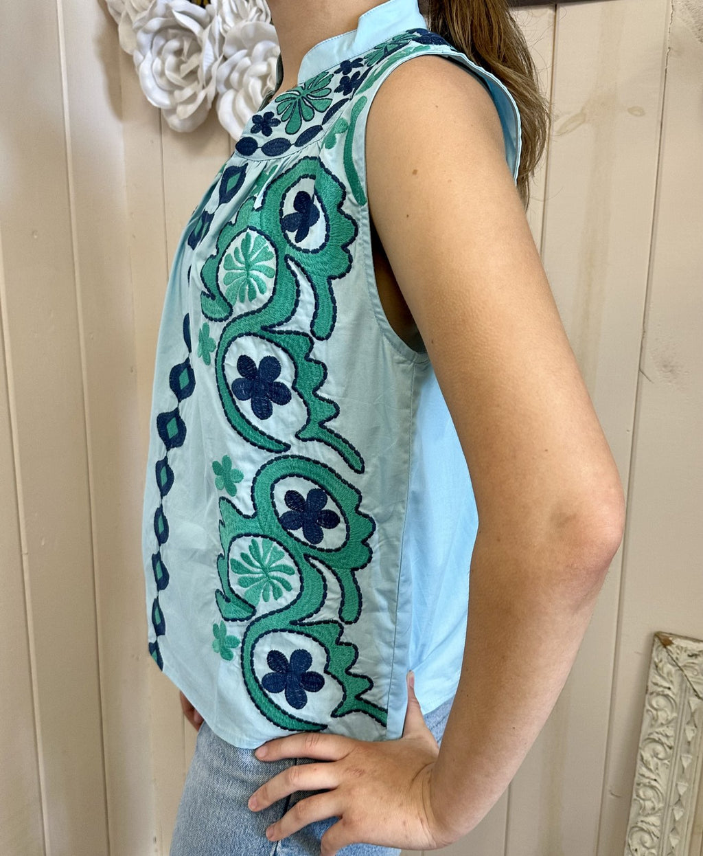 Molly Top, a vibrant embroidered short sleeve shirt, ideal for coastal boutique clothing and tropical vacation dresses.