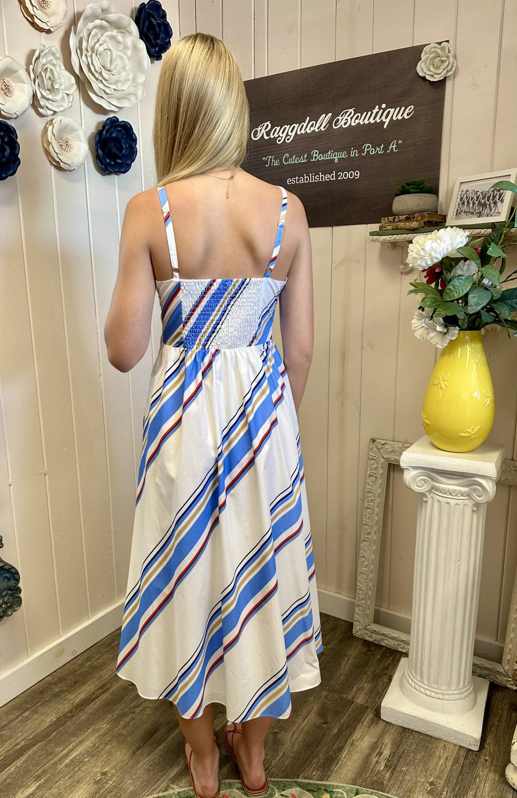 Heart neckline midi dress in blue and red multi-stripes, perfect for coastal boutique clothing and summer vacation style.