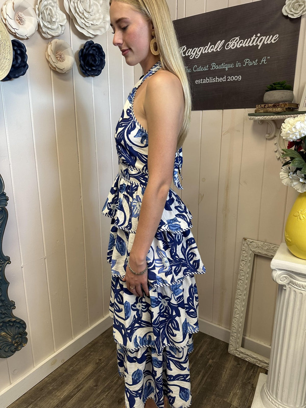 Breezy blue paisley midi dress with tiered silhouette at Raggdoll Boutique, perfect for summer coastal fashion.