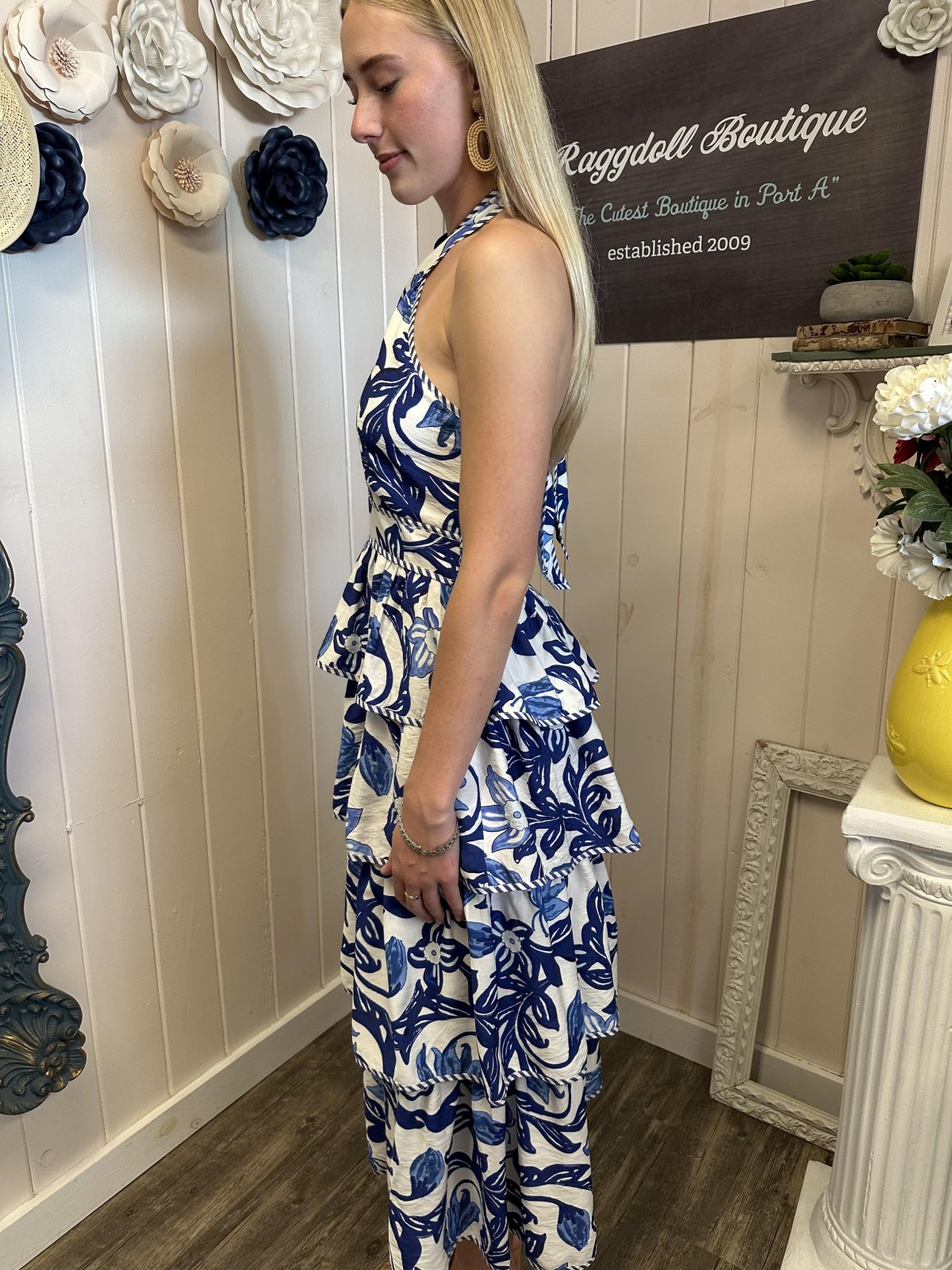 Breezy blue paisley midi dress with tiered silhouette at Raggdoll Boutique, perfect for summer coastal fashion.