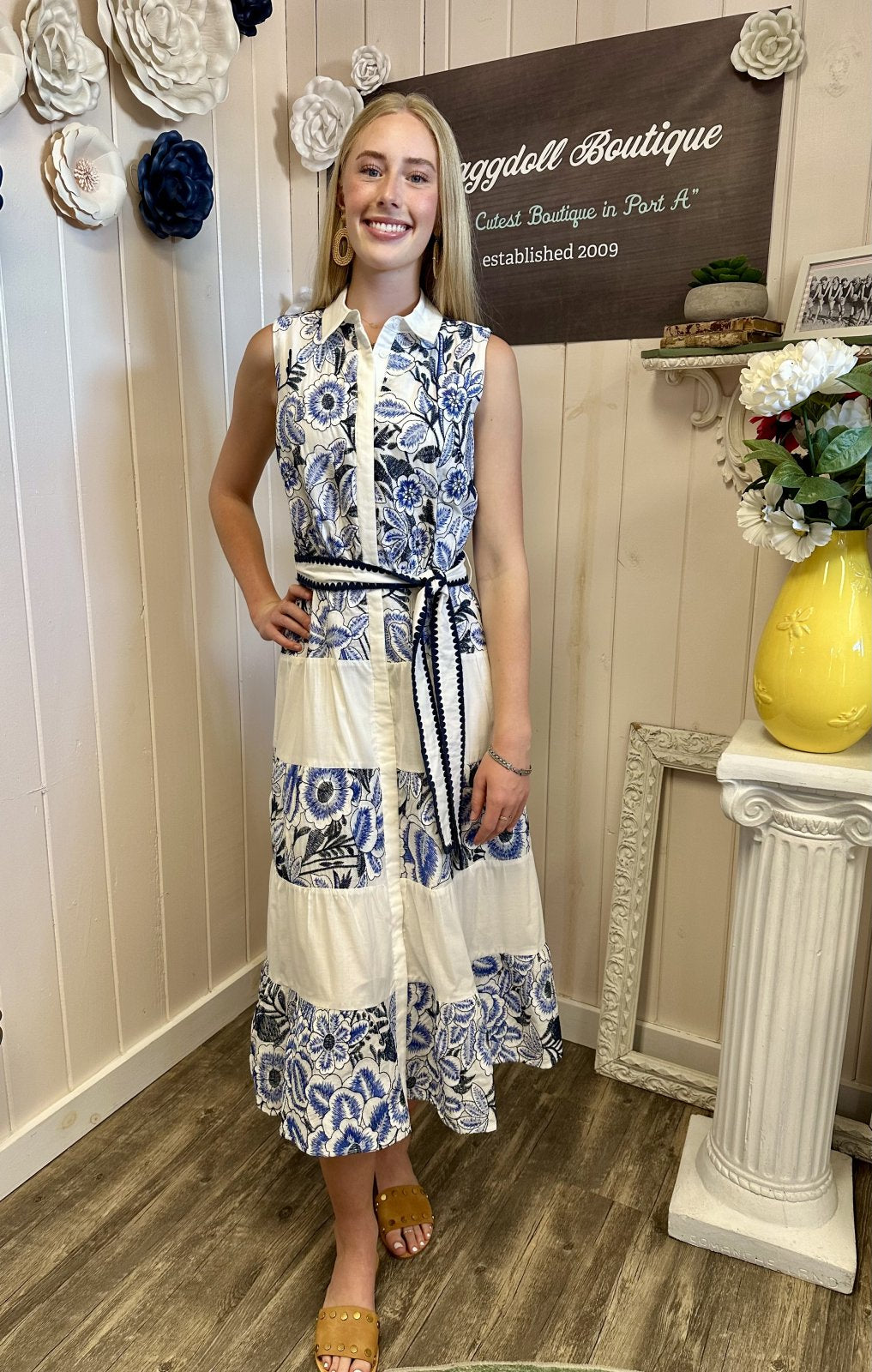 Model wearing Ethena embroidered sleeveless midi dress, a stylish addition to any coastal boutique clothing collection.