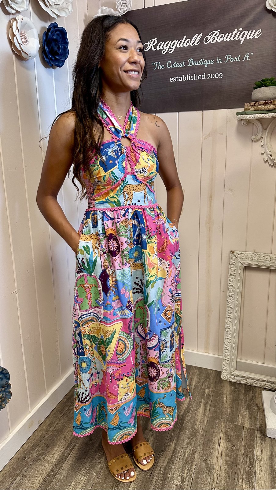 Model wearing multi-colored Ric Rac Cross Midi Dress from Raggdoll Boutique, showcasing a playful and stylish summer look.