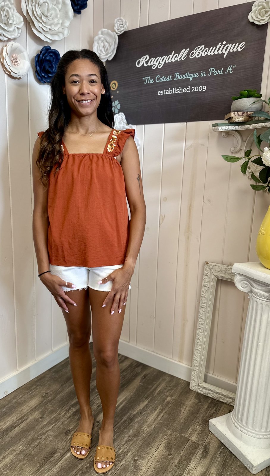Boho rust embroidered ruffle sleeve tank showcased at Raggdoll Boutique, perfect for coastal boutique clothing and beach dresses.