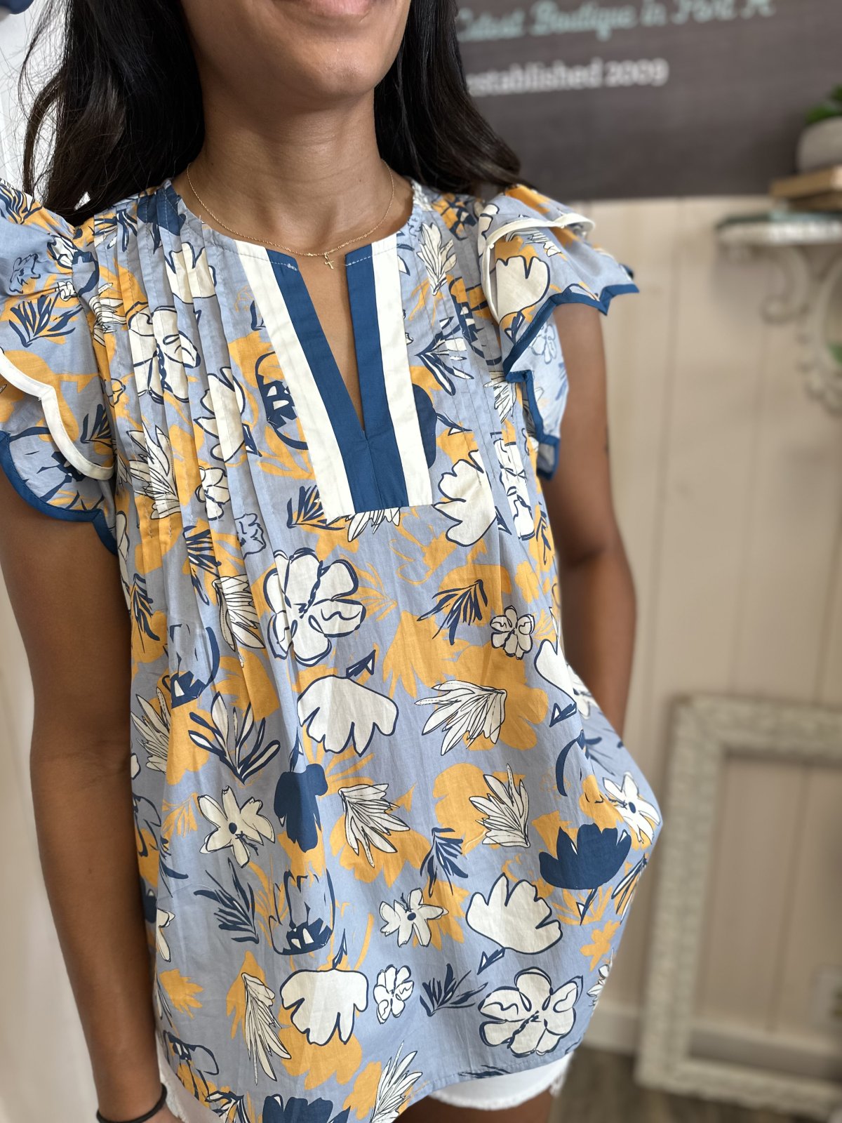 Slate Blue Floral Print Tiered Flutter Sleeve Top, perfect for coastal boutique clothing and summer outfits.