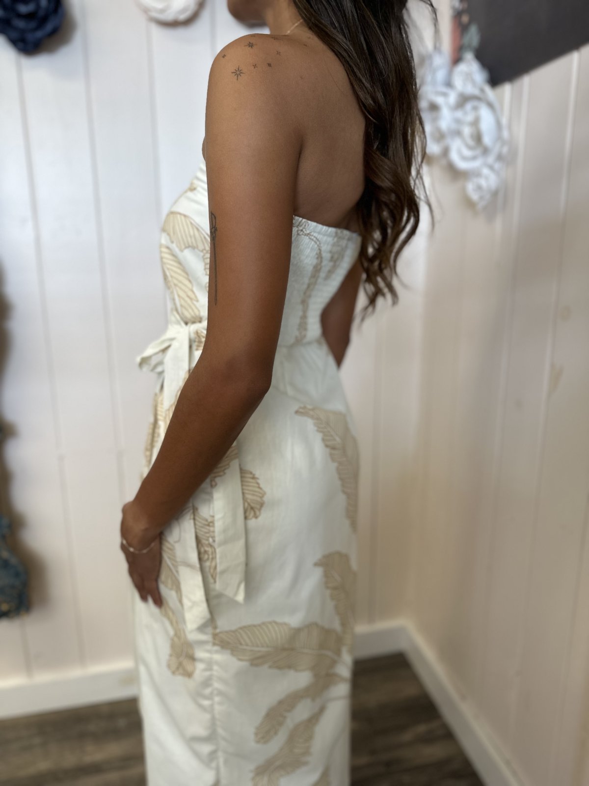Strapless white Adele dress with taupe palm tree print, perfect for coastal boutique clothing and tropical vacation styles.