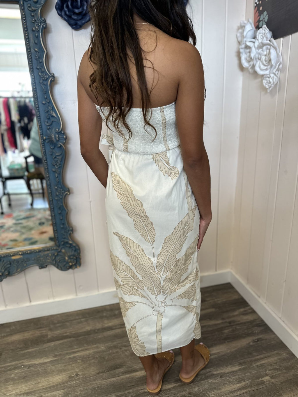 Back view of the Adele Dress, a stylish strapless tropical dress with palm print, ideal for coastal boutique clothing and beach vacations.