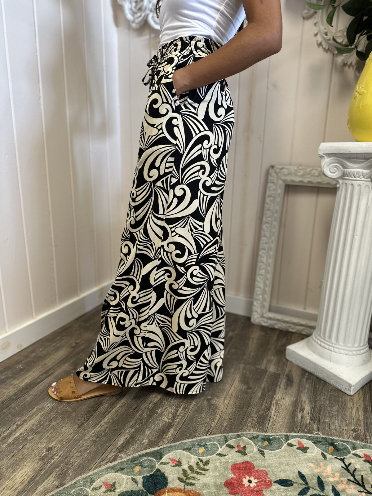 Stella Pants: Stylish black printed wide leg pants, perfect for coastal boutique clothing and curvy plus size fashion.