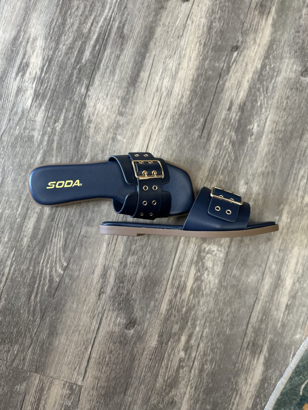 Kendra Navy Slide flat sandals for women from a Port Aransas boutique, perfect for beach dresses and casual outings.