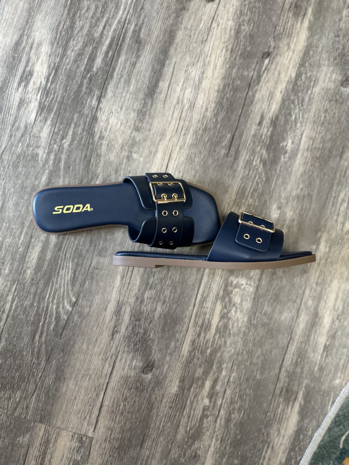 Kendra Navy Slide flat sandals for women from a Port Aransas boutique, perfect for beach dresses and casual outings.
