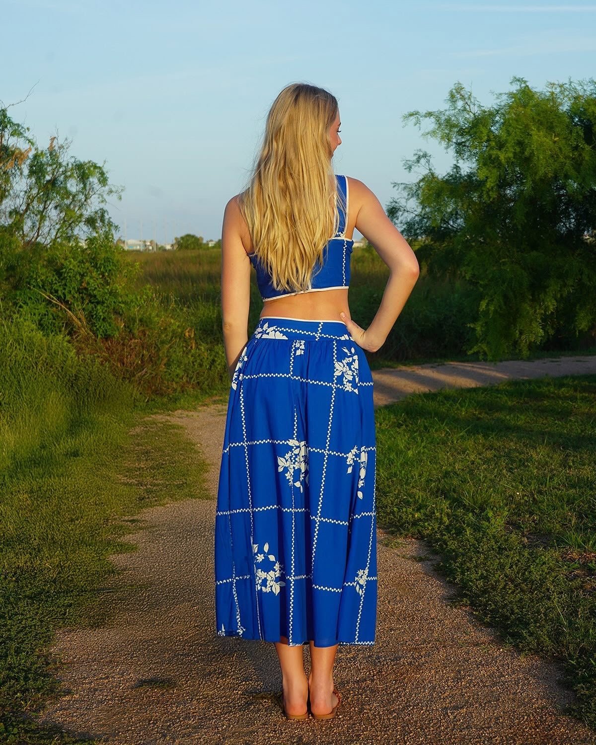 Vibrant cobalt blue two-piece set with floral grid print, perfect for coastal boutique clothing and tropical vacation dresses.