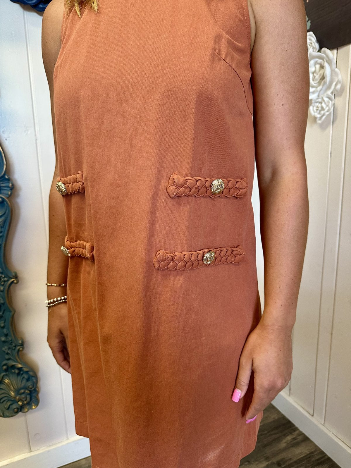 Rust-colored denim mini dress with braid detailing, ideal for coastal boutique clothing and tropical vacation dresses.
