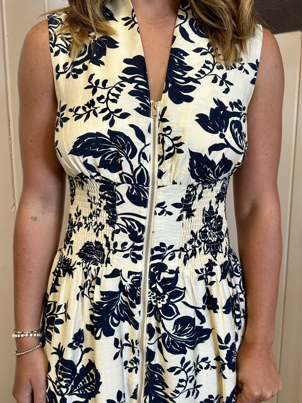 LeAnna Dress showcasing a floral navy print, perfect for summer outfits Texas, available at Raggdoll Boutique.