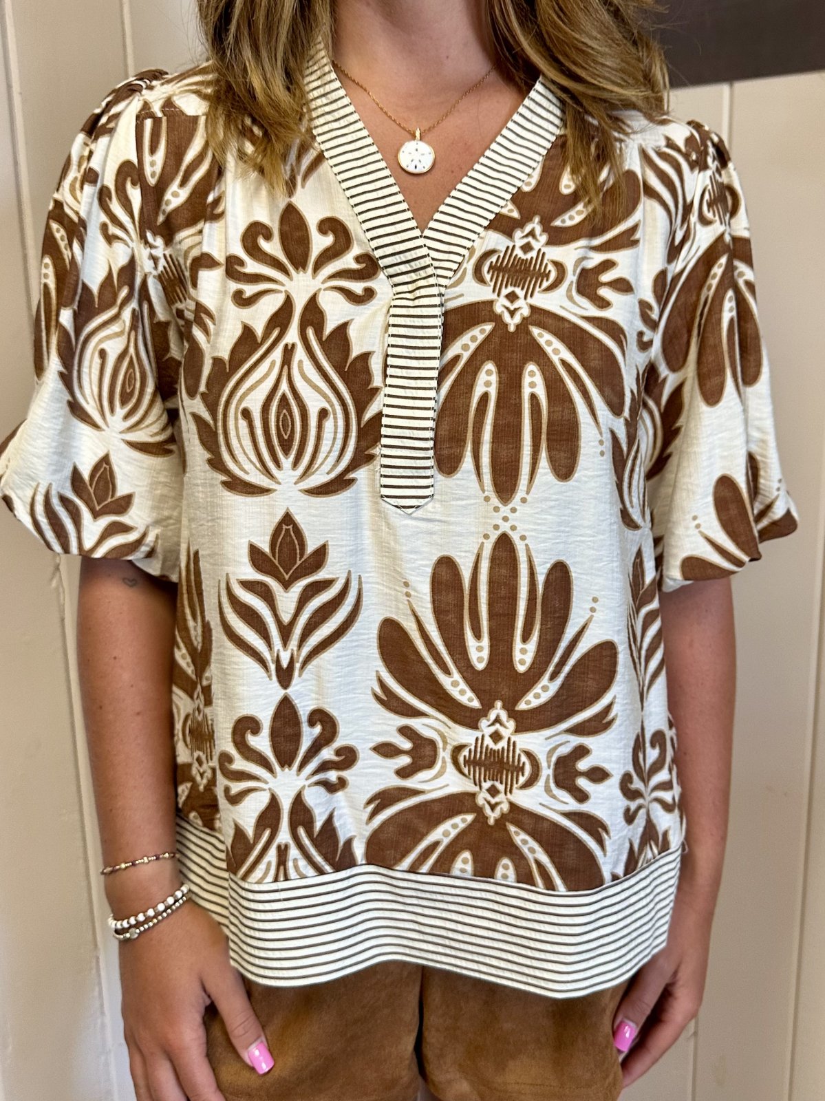Cammy Top featuring camel colored bubble sleeves, trendy prints from Raggdoll Boutique, perfect for coastal fashion.