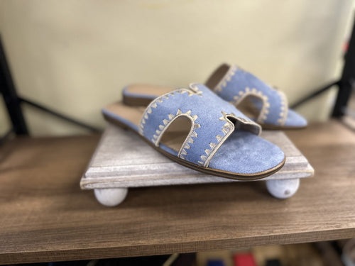 Melly Blue Shoe: Stylish tan suede cut-out slip-on sandals, perfect for coastal boutique clothing and tropical vacation dresses.