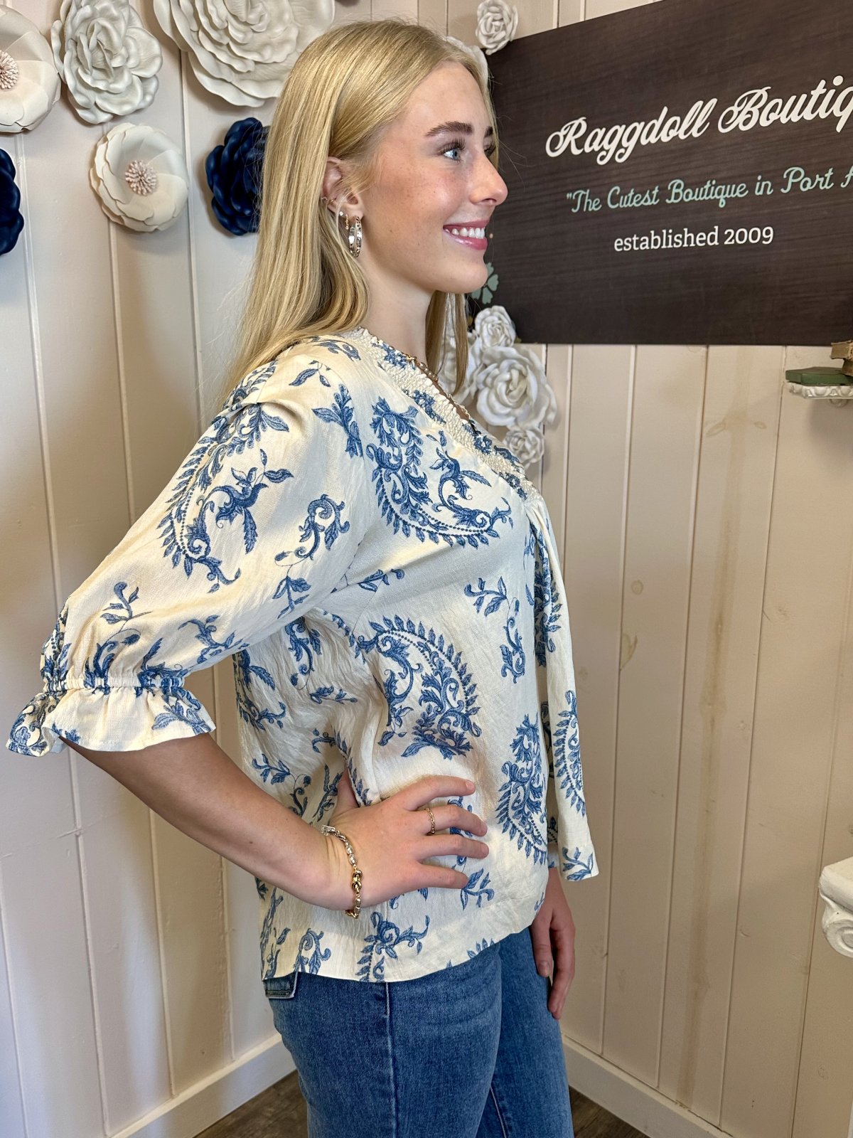 Model showcasing a boutique top from Raggdoll Boutique, Port Aransas, perfect for trendy coastal styles.