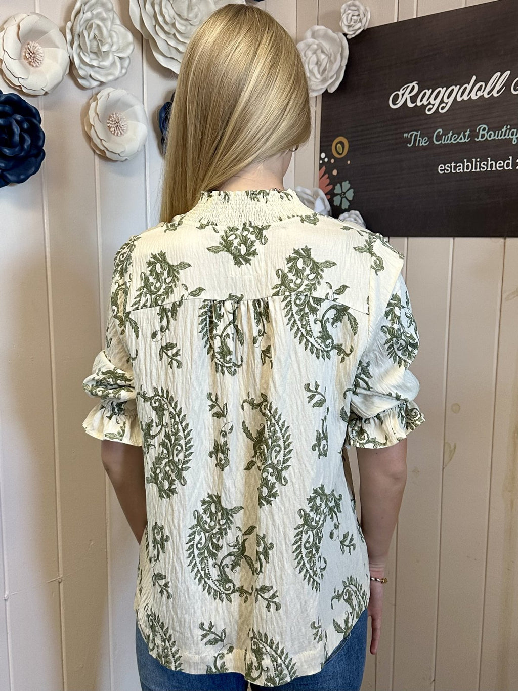 Back view of Maddy Top from Raggdoll Boutique with floral pattern and ruffle sleeves, perfect for summer outfits Texas.