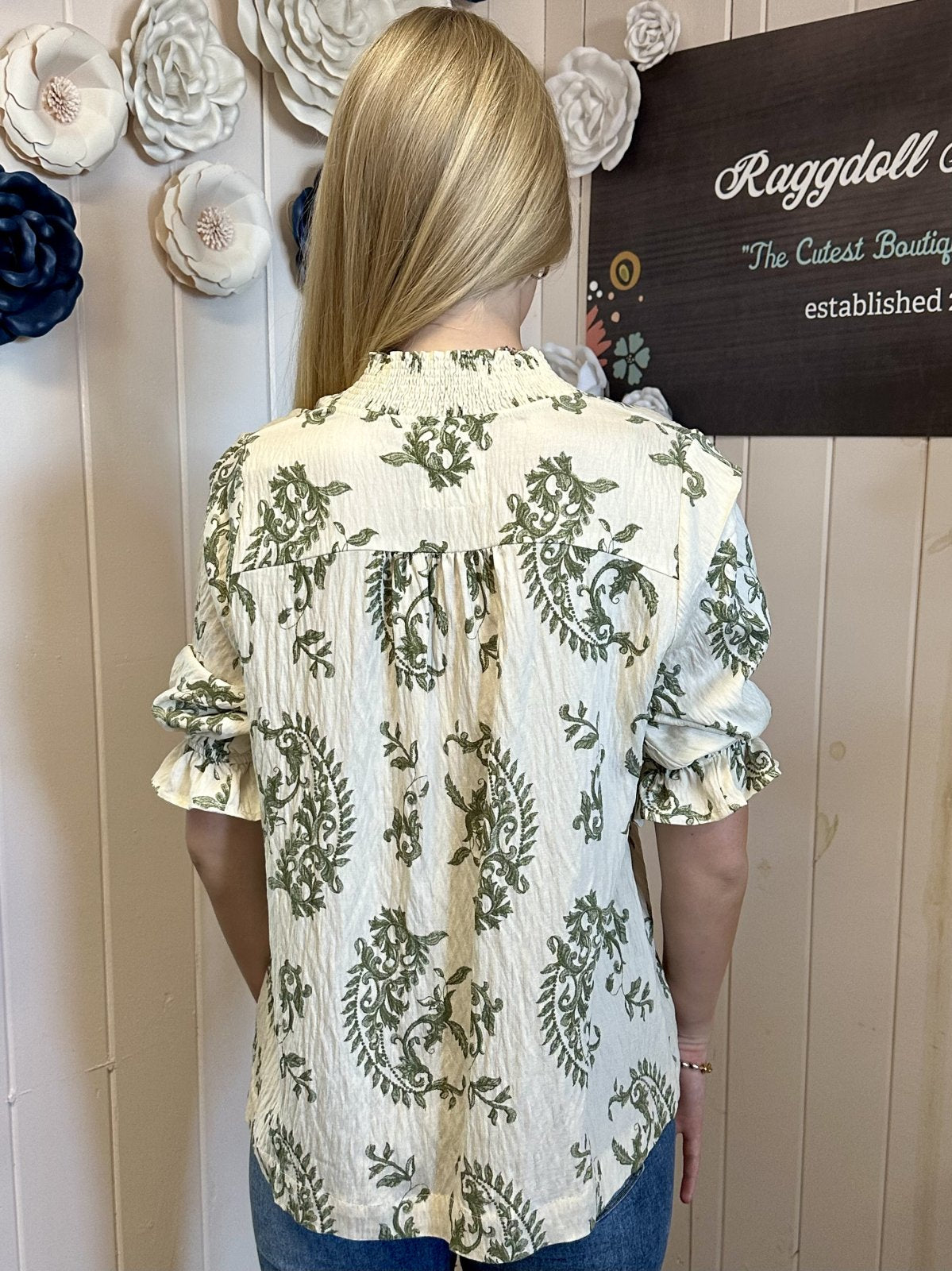 Back view of Maddy Top from Raggdoll Boutique with floral pattern and ruffle sleeves, perfect for summer outfits Texas.