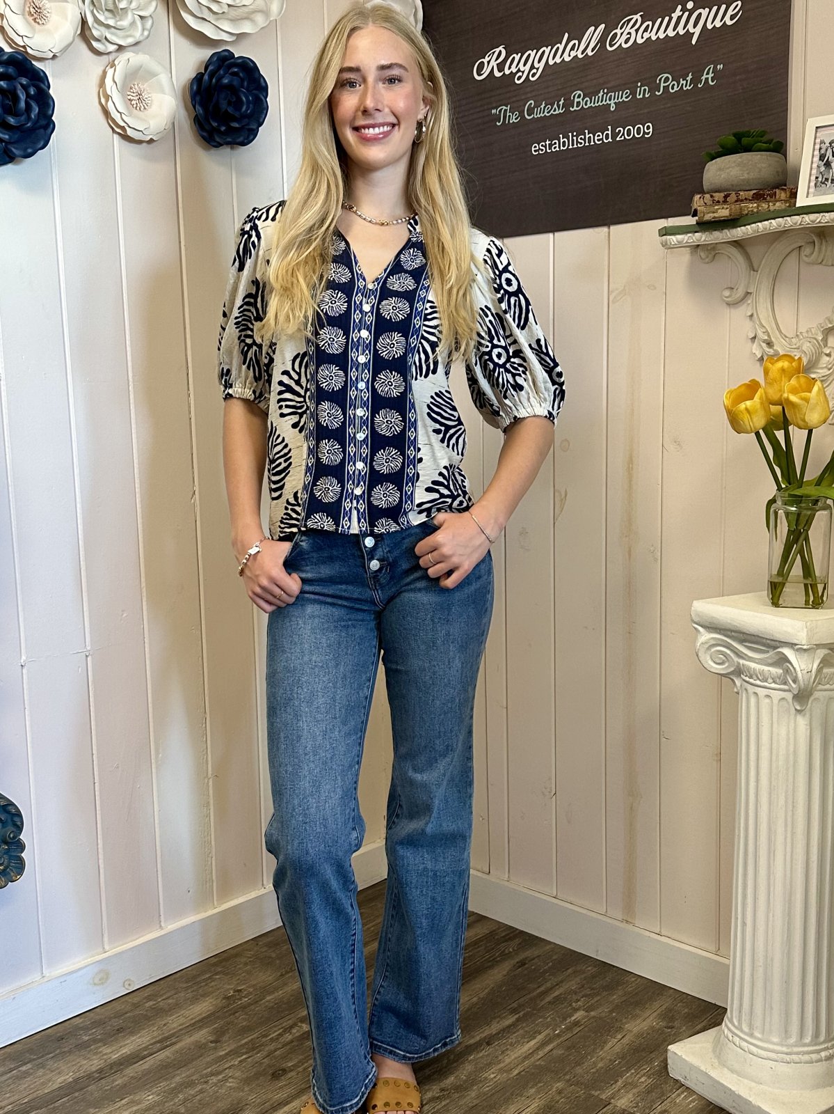 Mary Top from Raggdoll Boutique, featuring puff sleeves and a button front, perfect for trendy coastal style and summer outfits.