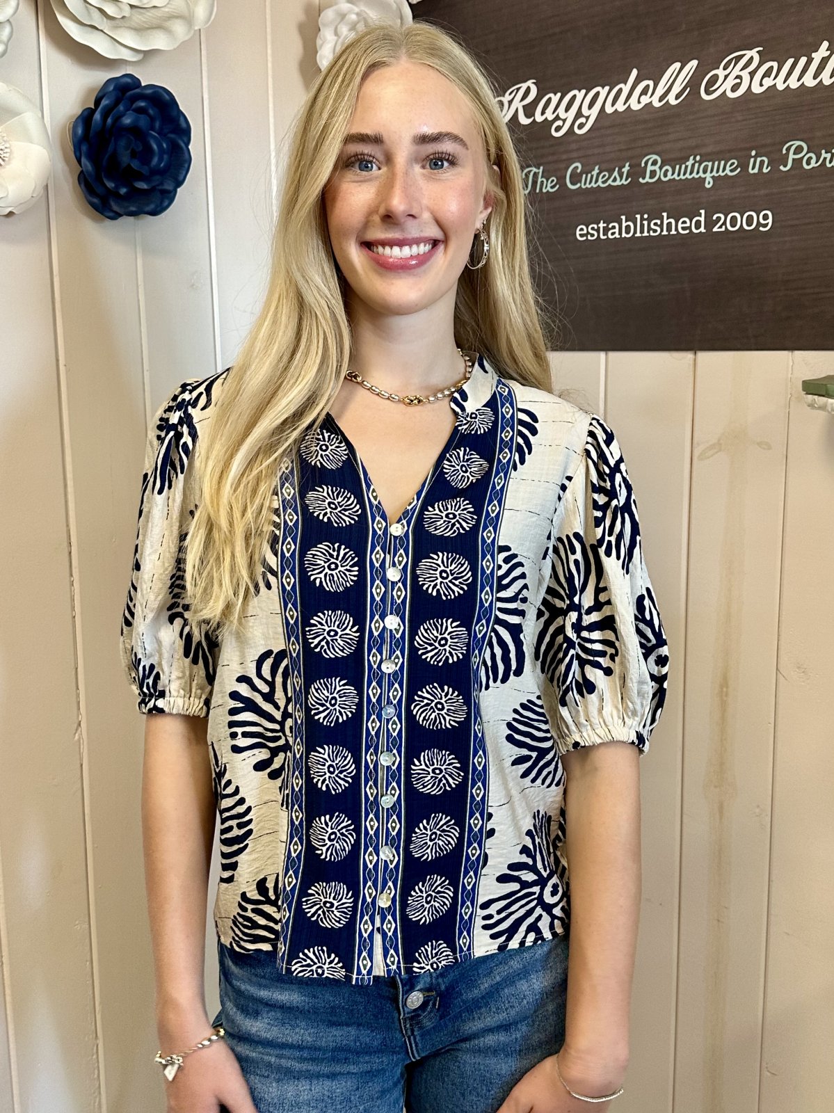 Mary Top from Raggdoll Boutique features stylish puff sleeves and abstract print, perfect for trendy coastal style.